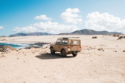 View of car on desert land