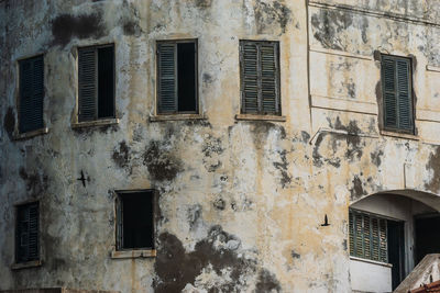 Shadow on the wall from two passing birds. cape coast castle is one of about forty slave castles, 