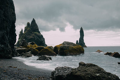 Scenic view of sea against cloudy sky