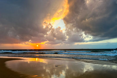 Scenic view of sea against sky during sunset