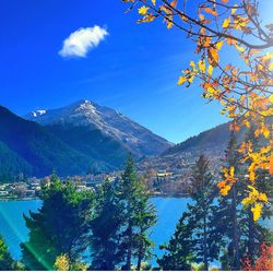 Scenic view of mountains against blue sky