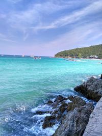 Scenic view of sea against cloudy sky