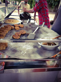 People preparing food on table