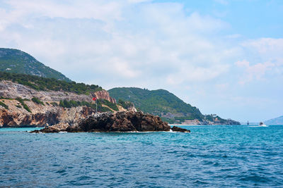 Scenic view of bay against sky