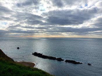 Scenic view of sea against sky at sunset