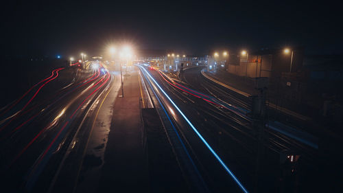 High angle view of light trails on road at night