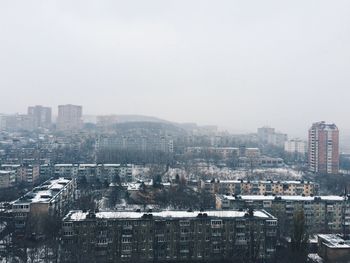 High angle view of buildings in city against sky