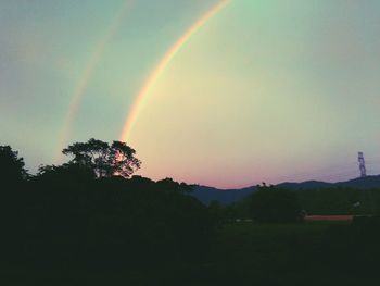 Rainbow over mountain against sky