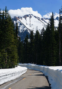 Scenic view of snow covered mountains against sky