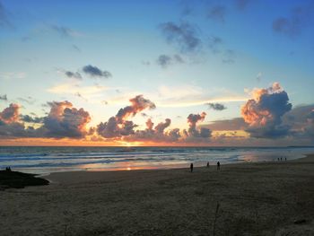 Scenic view of beach against sky during sunset