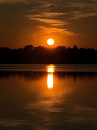Scenic view of lake against romantic sky at sunset
