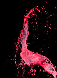 Close-up of water splashing against black background