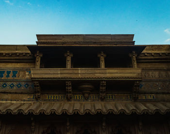 Low angle view of historical building against blue sky