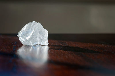 Healing crystals clear quartz on a wooden table