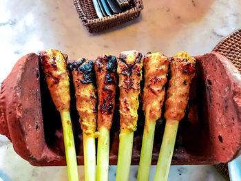 High angle view of meat on barbecue grill