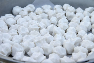 Close-up of potato cakes in container