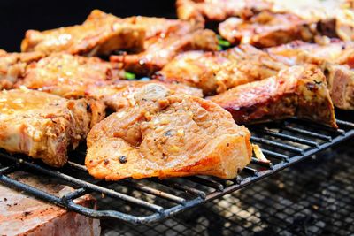 Close-up of meat on barbecue grill