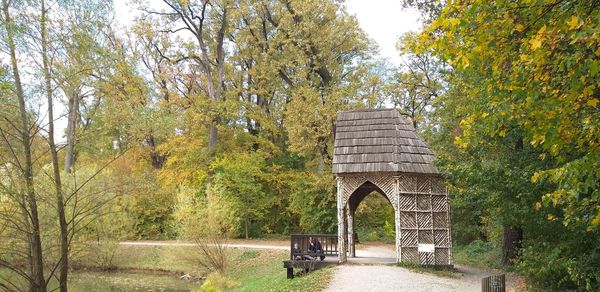 Bridge amidst trees in park during autumn
