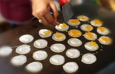 Midsection of person preparing food