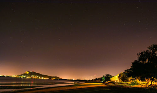 Scenic view of mountains against sky at night