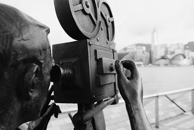 Woman photographing in city