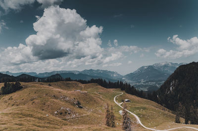 Scenic view of mountains against sky during sunny day