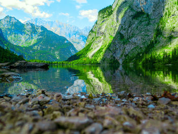 Scenic view of lake and mountains against sky