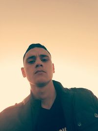 Portrait of mid adult man against sky during sunset