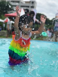 Girl playing in swimming pool