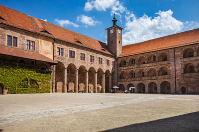 View of old building against cloudy sky