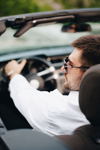 Close-up of man driving car