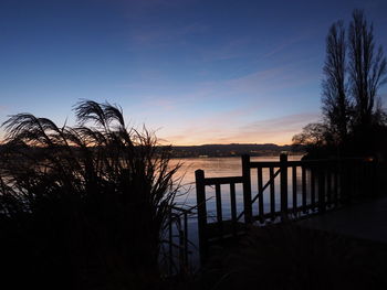 Scenic view of landscape against sky at sunset