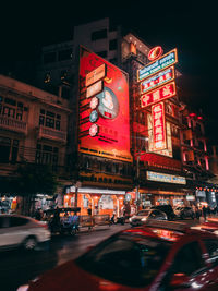 Illuminated city street at night