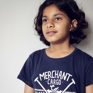 Portrait of smiling boy against white background