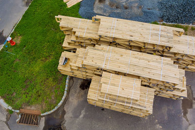 High angle view of stack of wood at construction site