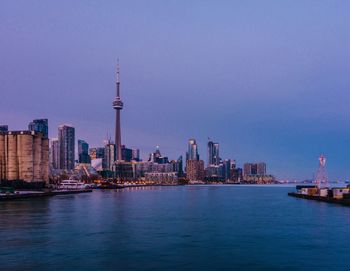 City at waterfront against sky