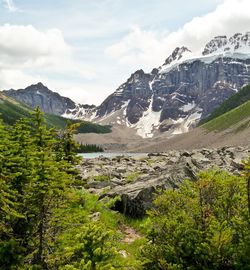 Scenic view of mountains against cloudy sky