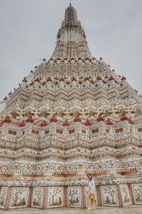 Low angle view of ornate building against sky