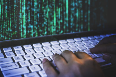 Close-up of hand using laptop