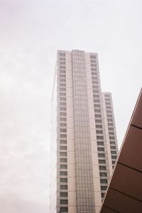 Low angle view of modern buildings against clear sky