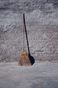 Old wooden broom abandoned in the street