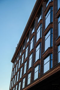 Modern office building, detailed view of finance house windows. pattern. office building, blue glass 