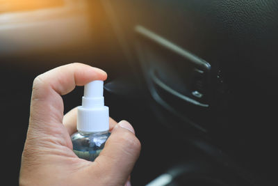 Close-up of hand holding camera