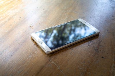 High angle view of smart phone on table