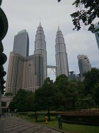 Modern buildings in city against sky