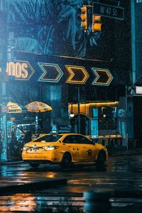 Cars on wet street at night