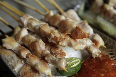 High angle view of meat on barbecue grill