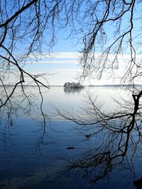 Scenic view of lake against sky during winter