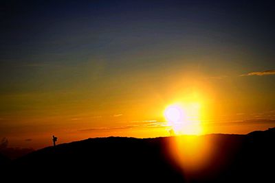 Scenic view of silhouette landscape against sky during sunset