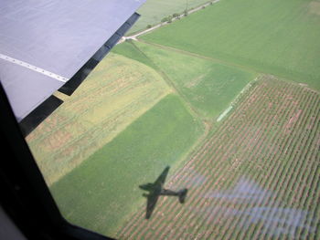 Aerial view of agricultural landscape against sky